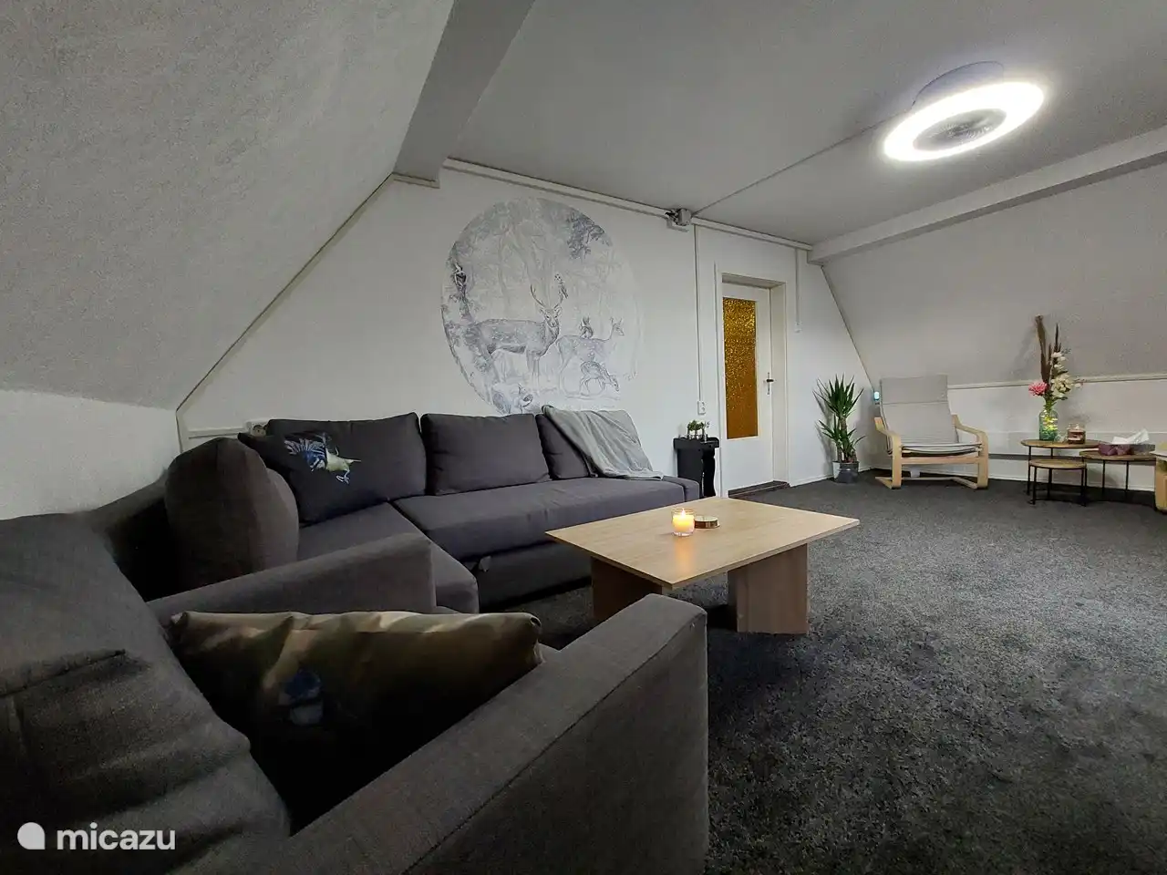 The spacious living room. The lamp in this room is equipped with a fan for some extra cooling on hot summer days.