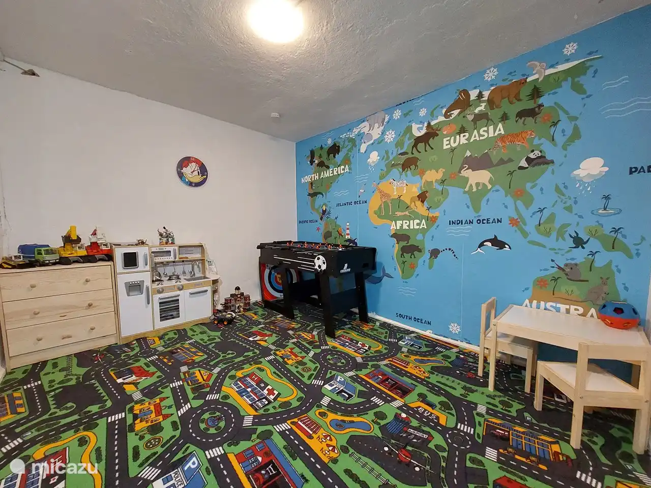For the children a cozy playroom with children's toys for different ages.