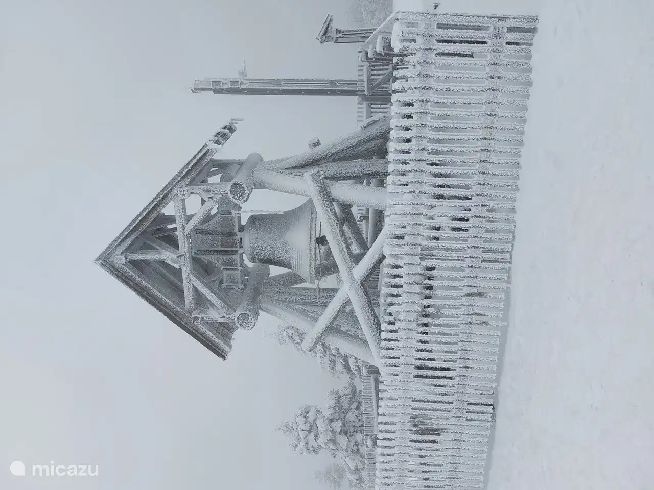 This is the old avalanche bell. it has not been used since 1988. but still stands proudly.