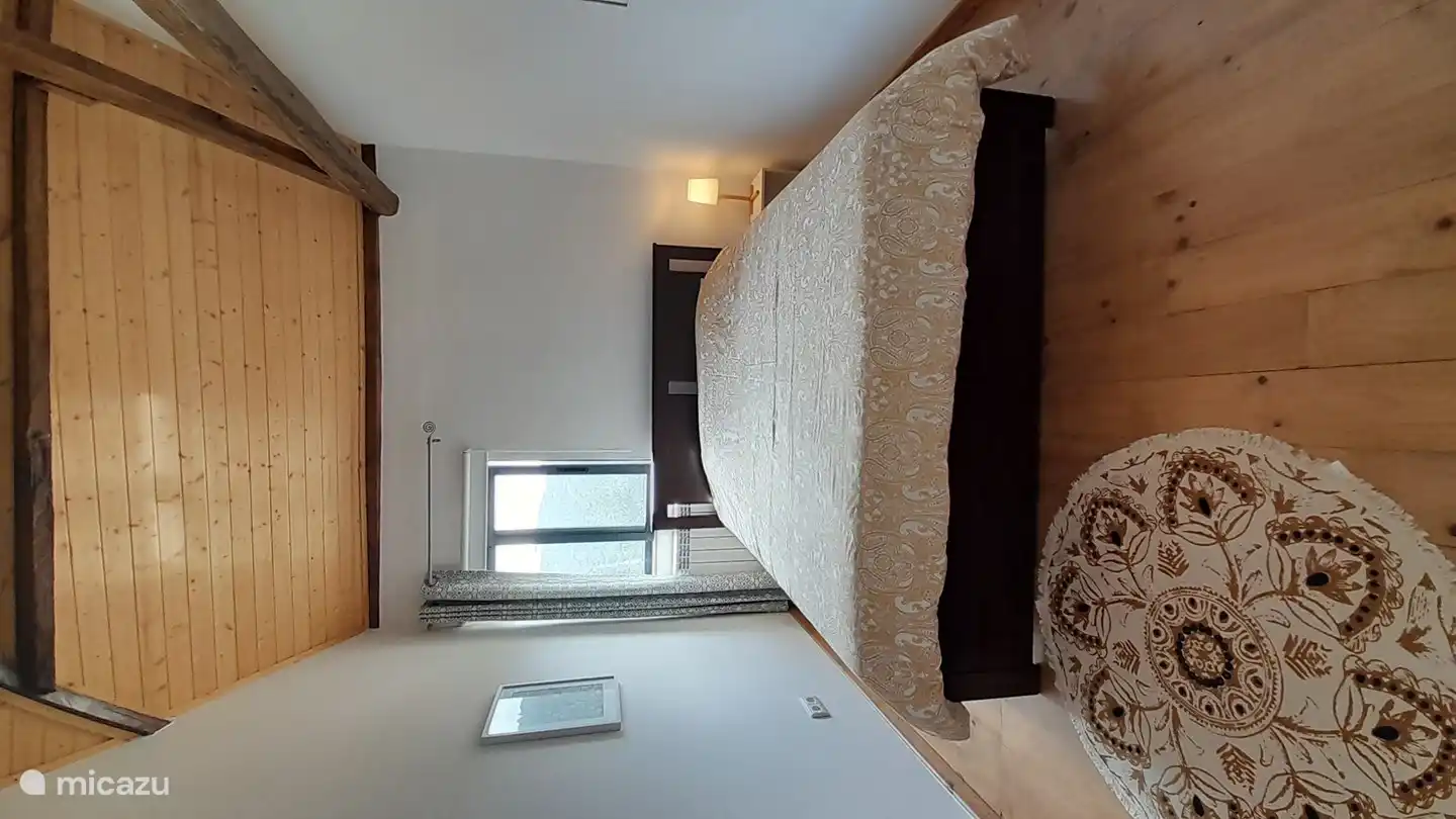 Das zweite Schlafzimmer mit einem Doppelbett