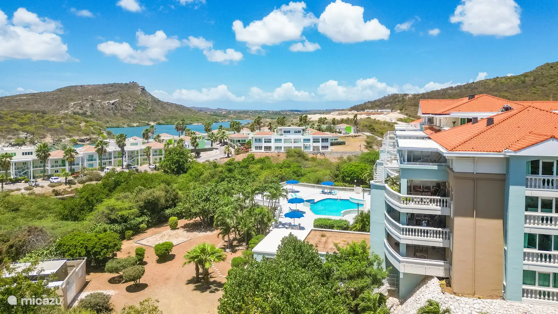 Side view of building/apartment with Piscadera Bay in the background 