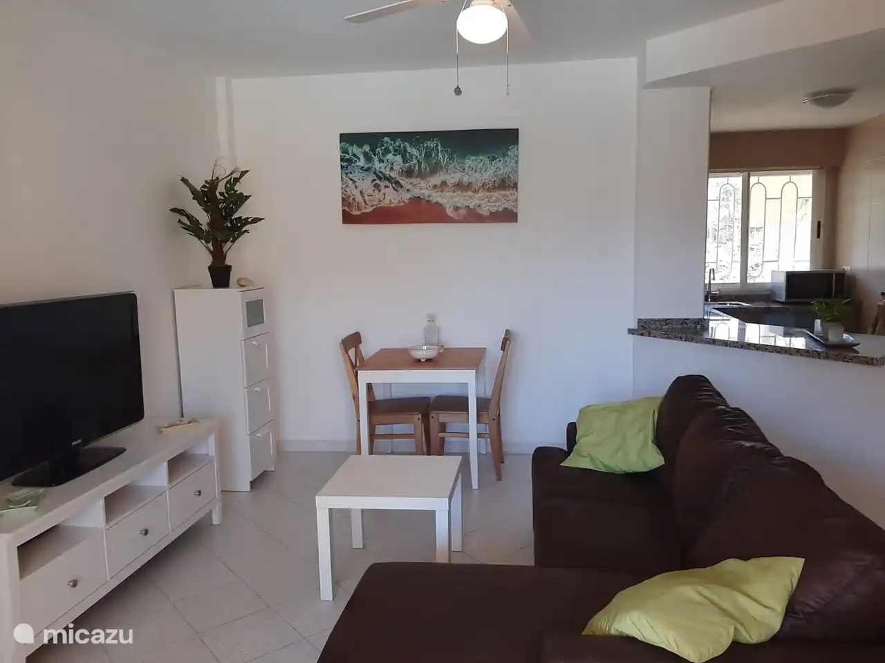 Living room with half open kitchen