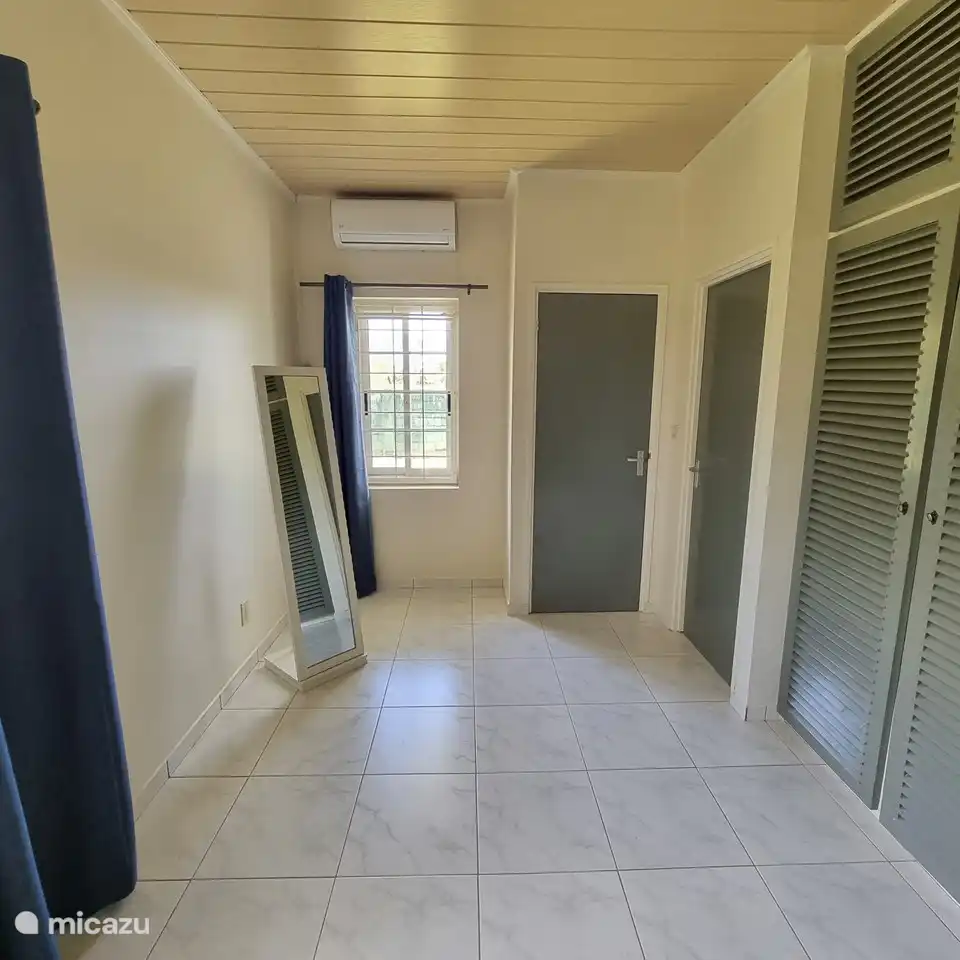 Doors to the bathroom and toilet of the master bedroom