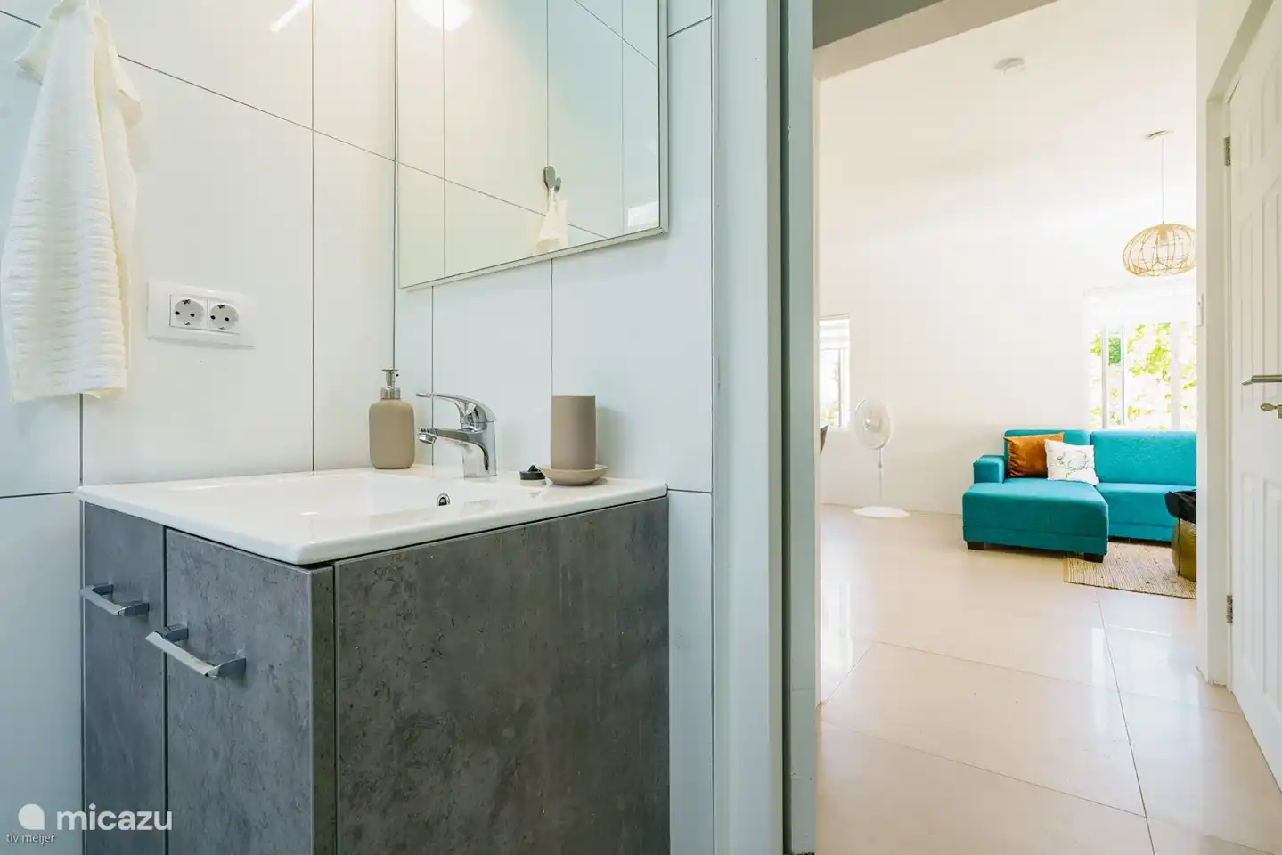 Washbasin equipped with all conveniences and a hair dryer.