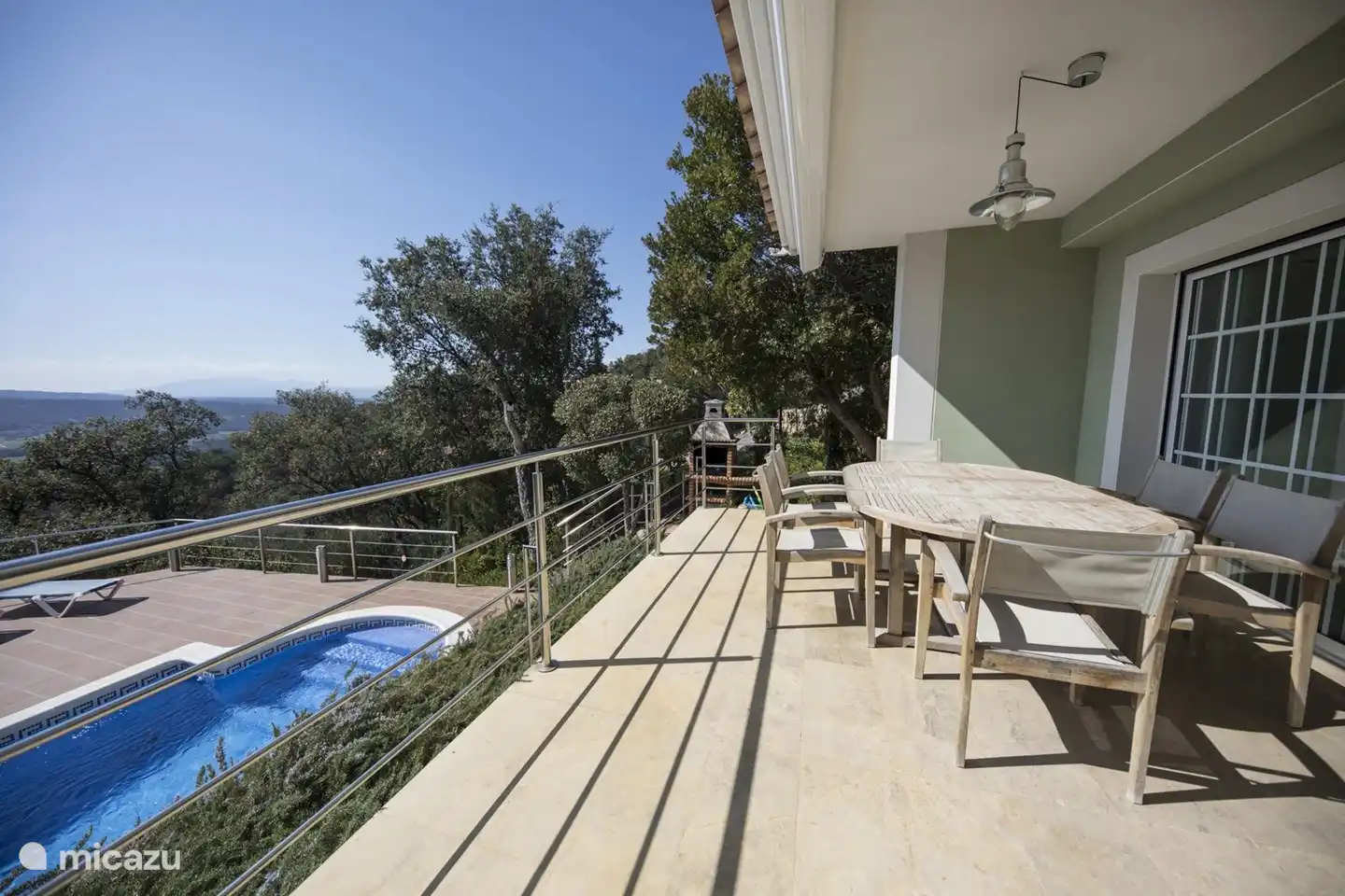 terrace with stairs to the pool