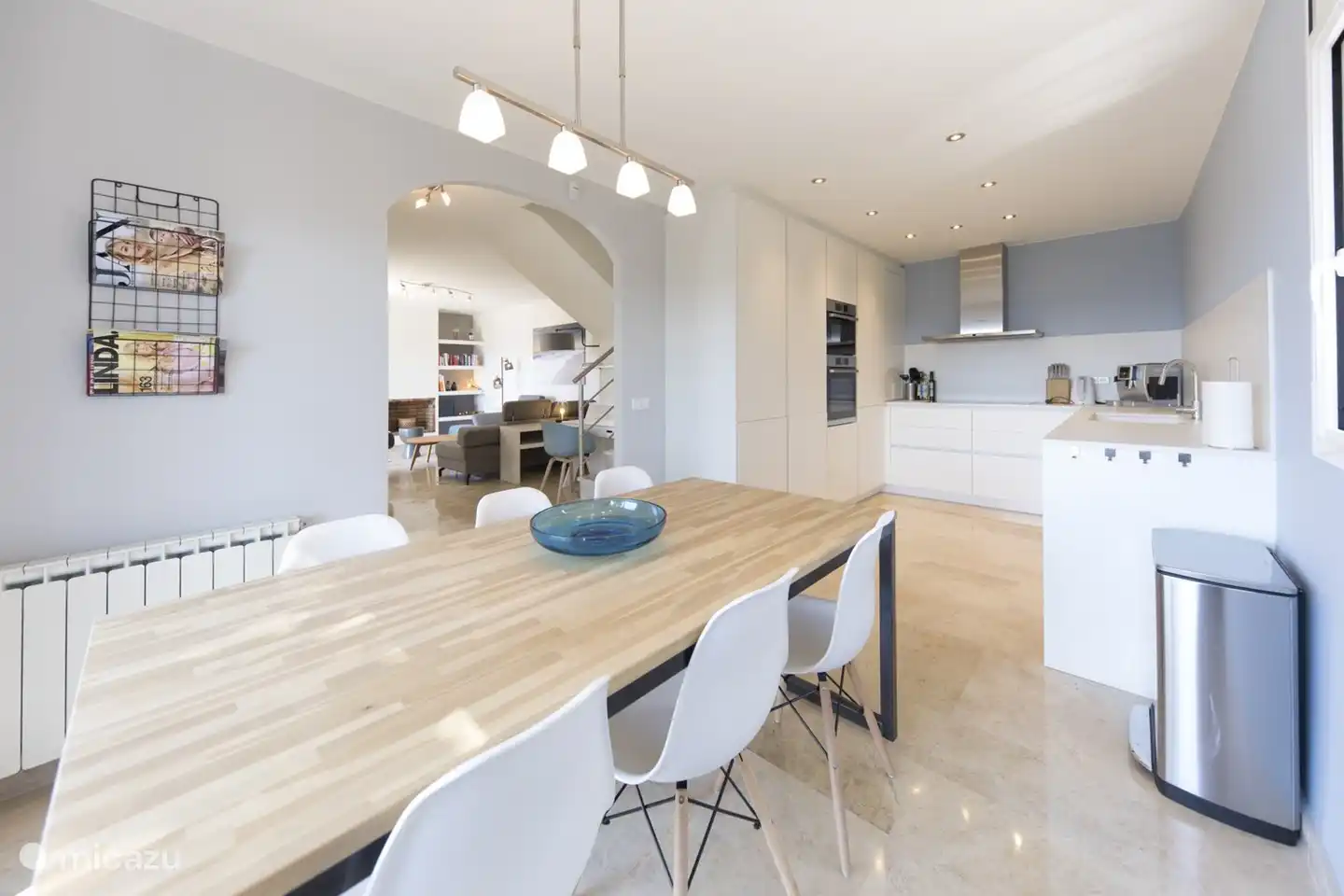 nice open kitchen with dining table, also entrance through sliding doors to the garden