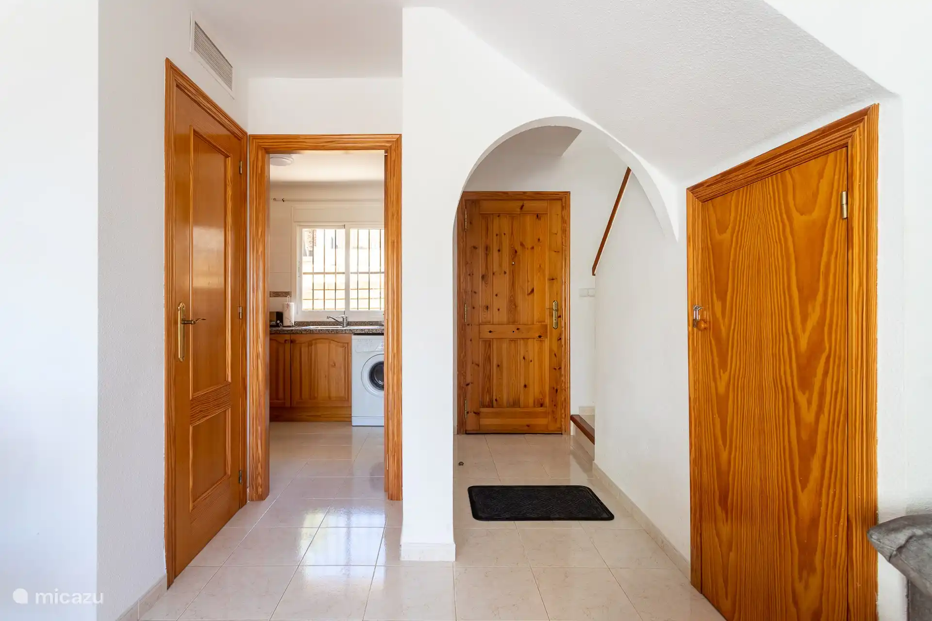 Entrance hall and adjacent entrance kitchen