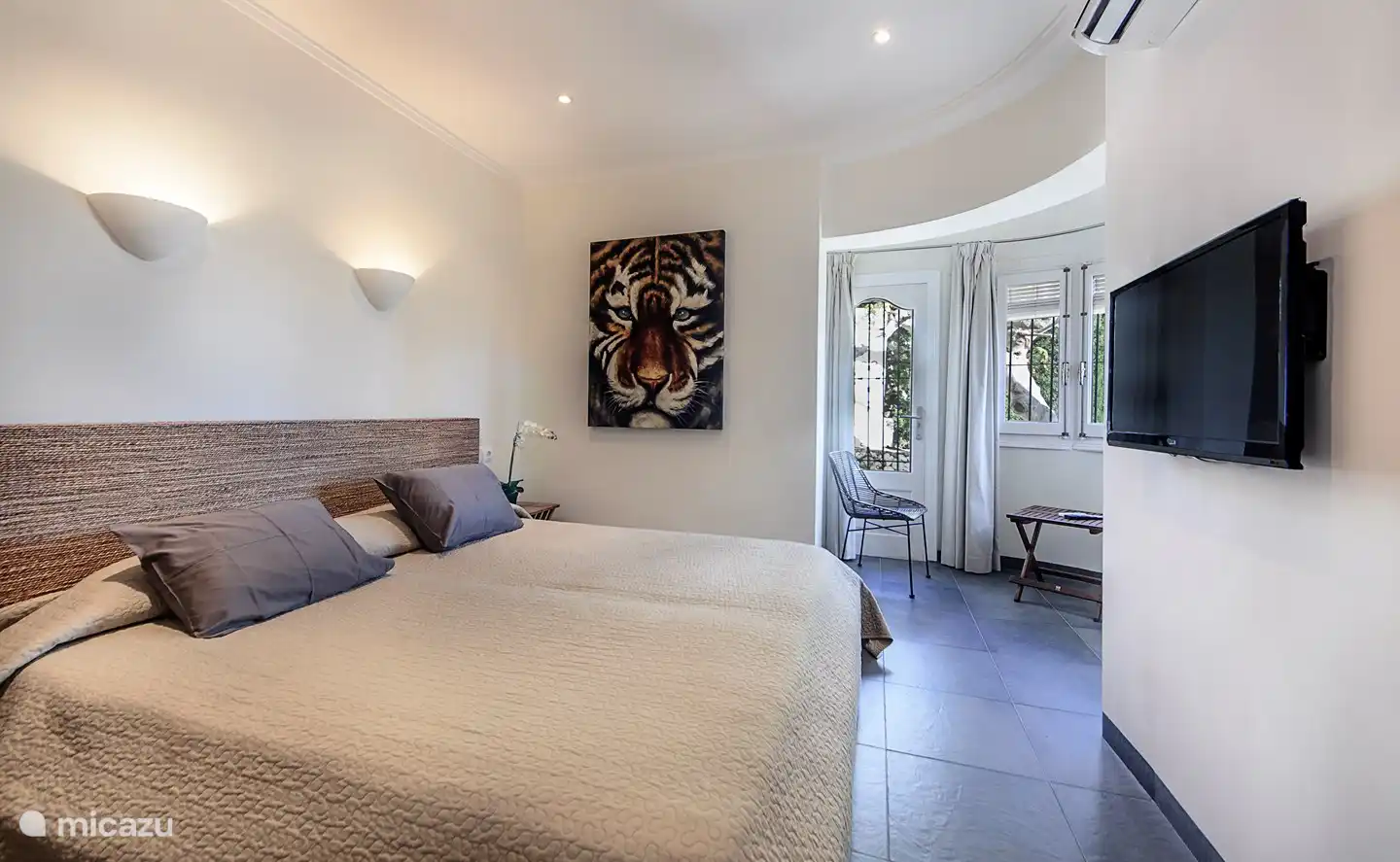 Master bedroom with en-suite bathroom and air conditioning