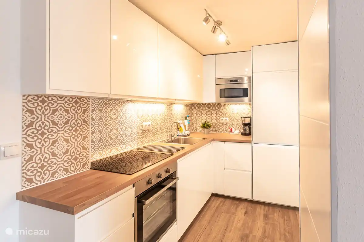 Fully equipped kitchen: dishwasher, oven, microwave, refrigerator with freezer, hob, Nespresso coffee maker