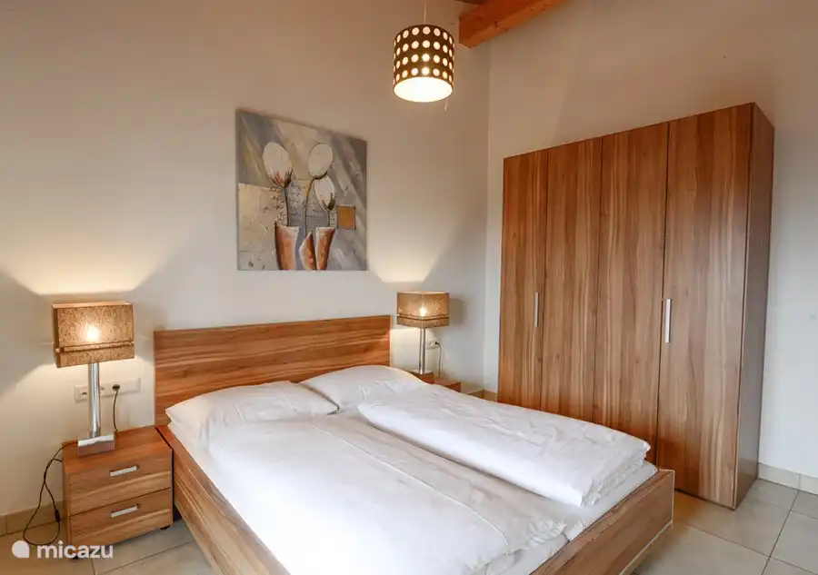 There are three luxurious bedrooms, one of which has a bunk bed.