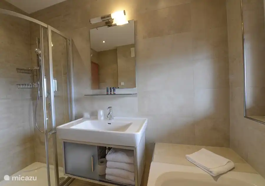 There are two luxurious bathrooms; one with bath, the other with shower