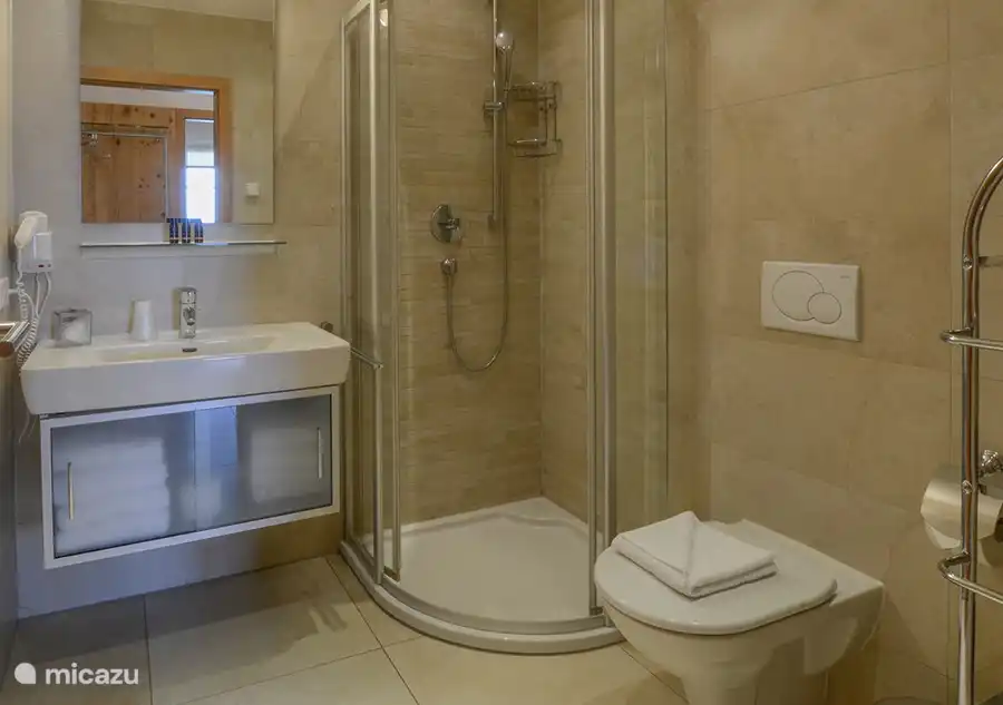 There are two luxurious bathrooms; one with bath, the other with shower