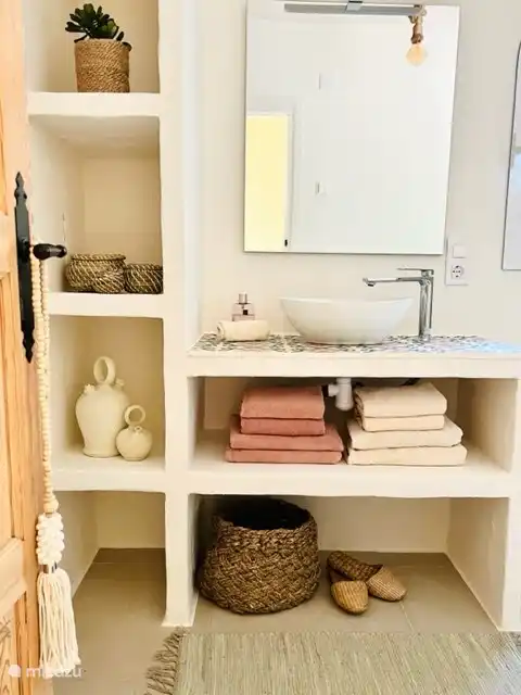 The bathroom on the first floor is finished with authentic tiles around the sink and is of course equipped with every comfort...