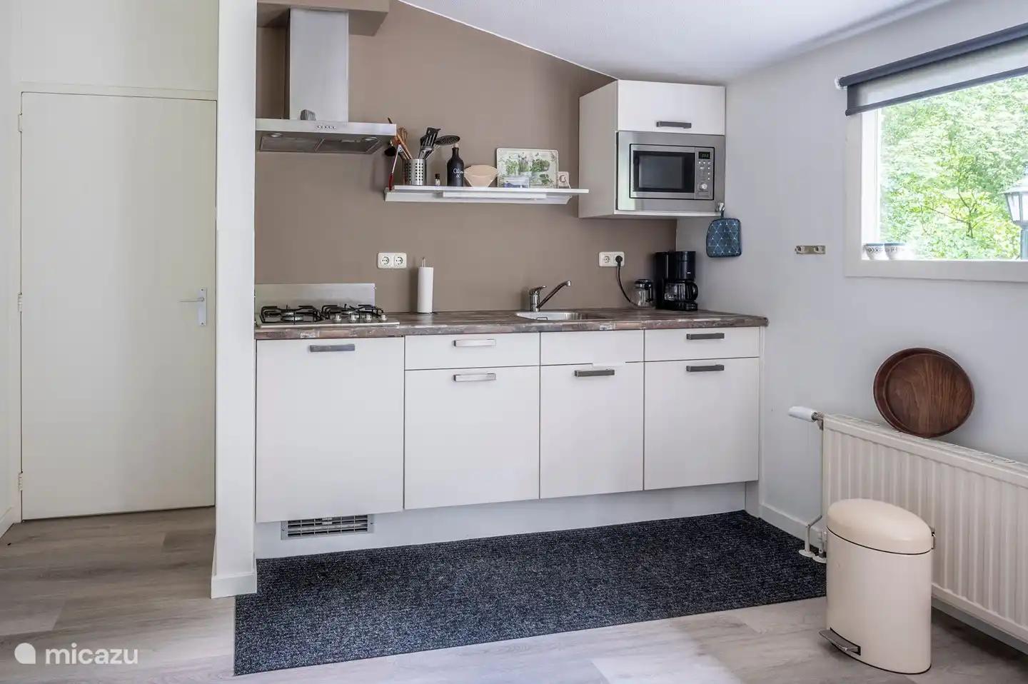 An open kitchen with microwave