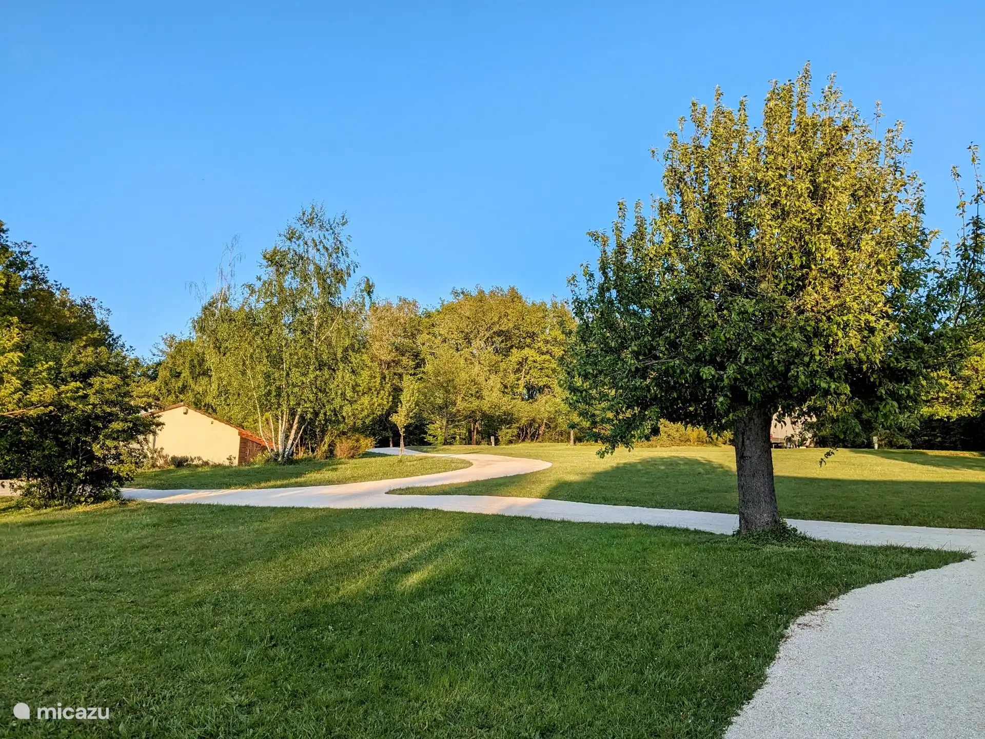 The small-scale campsite of which the house is part.
