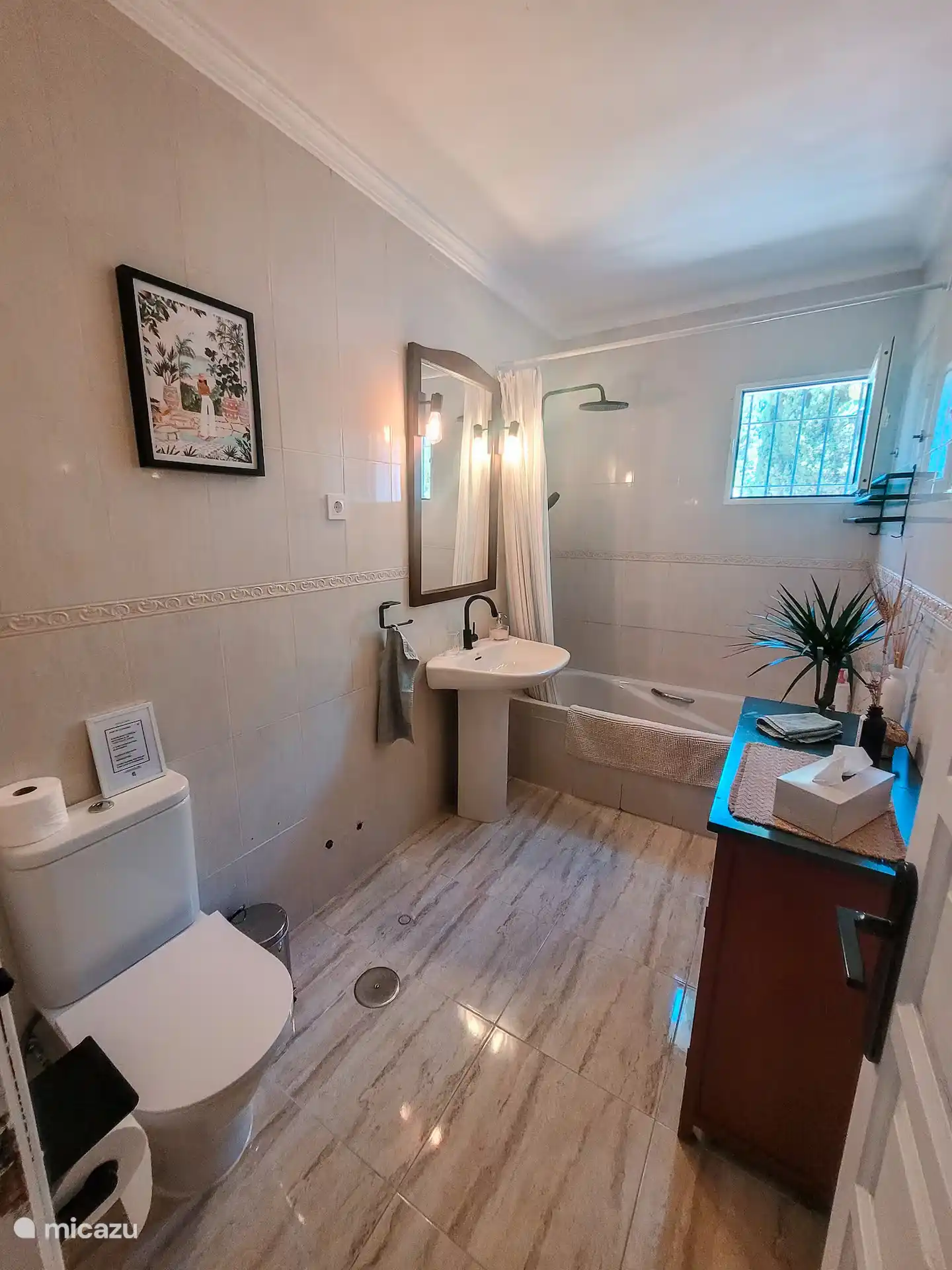 Large bathroom with bath, shower and toilet.