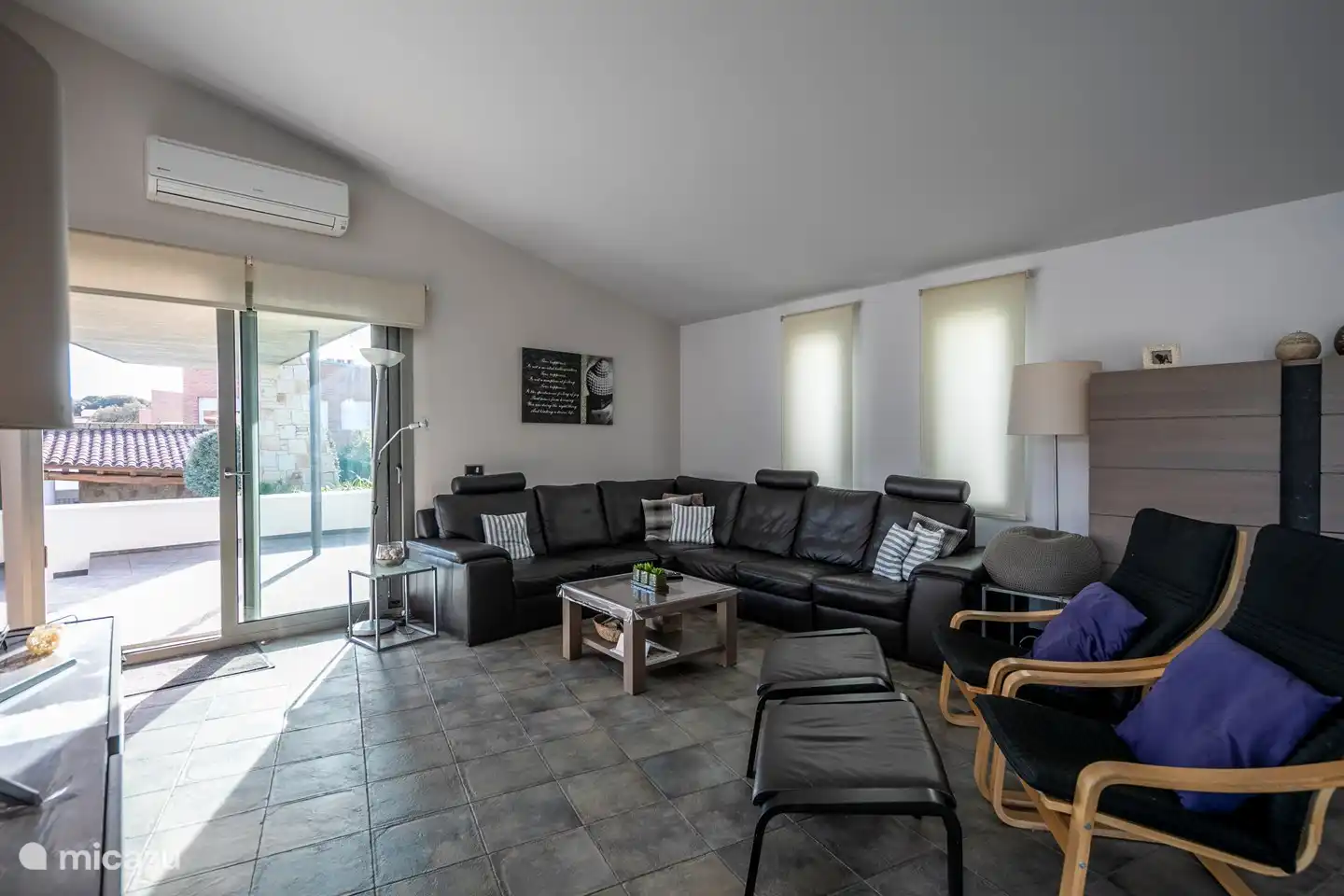 living room with entrance to the terrace and down to the pool