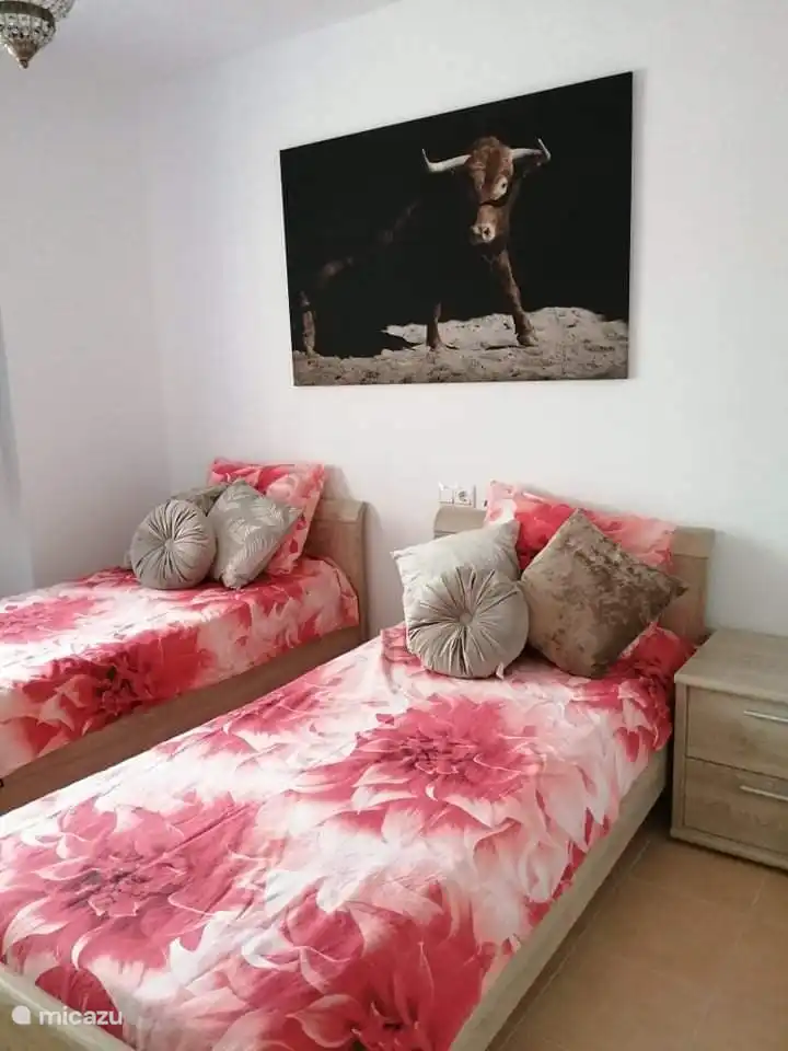 Bedroom with two single beds. Individual air conditioning