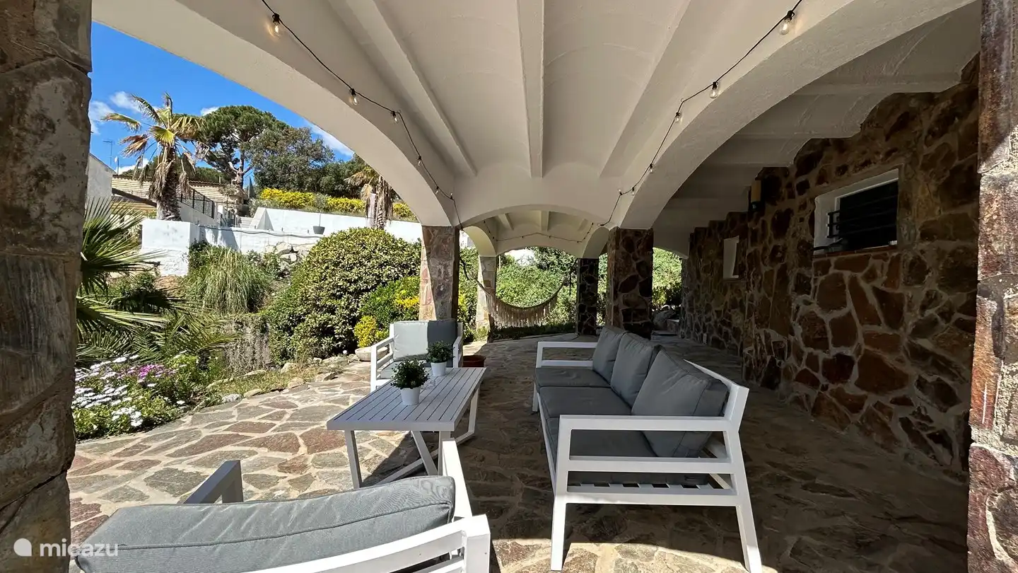 lounge set under the veranda to chill out in the shade.