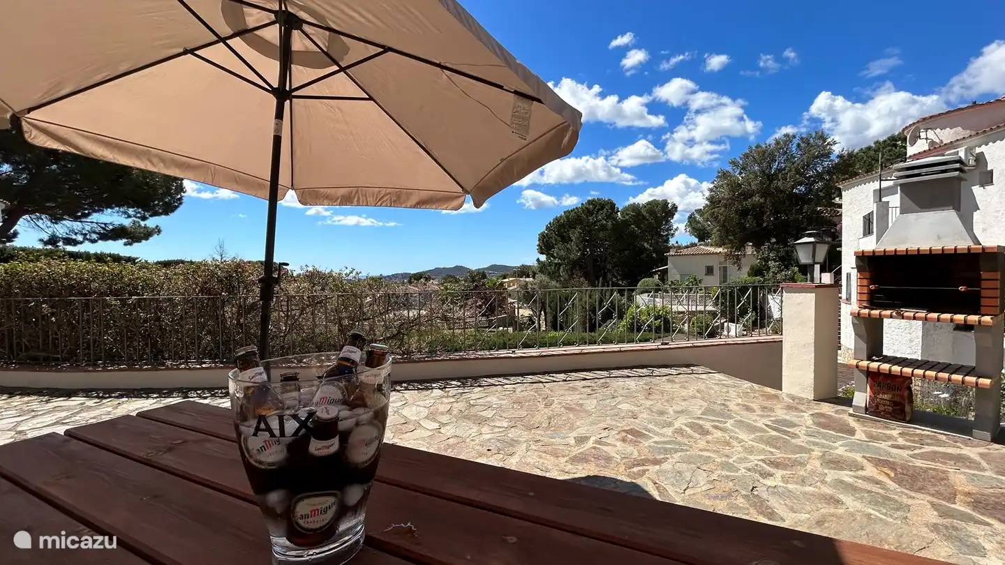 Picnic table at the fixed barbecue