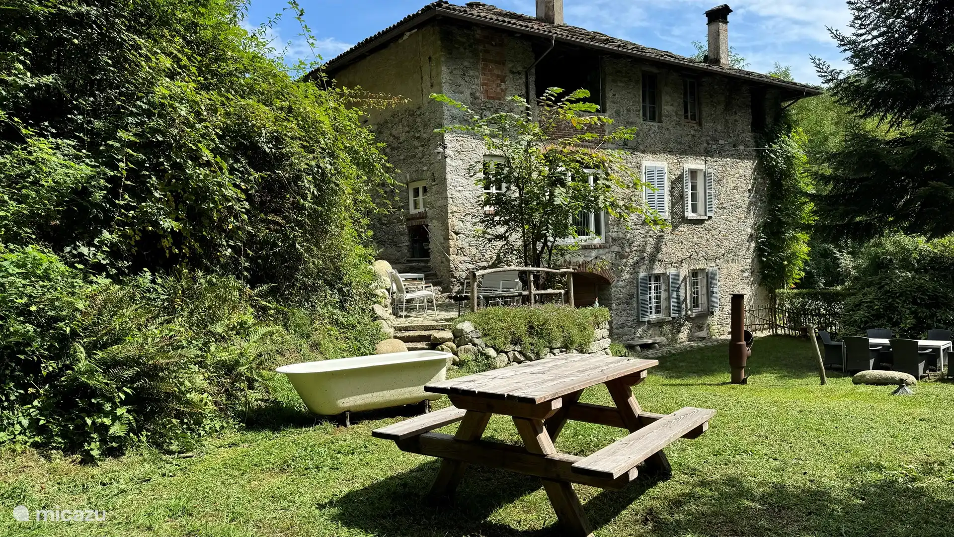 De tuin van appartement Stella.