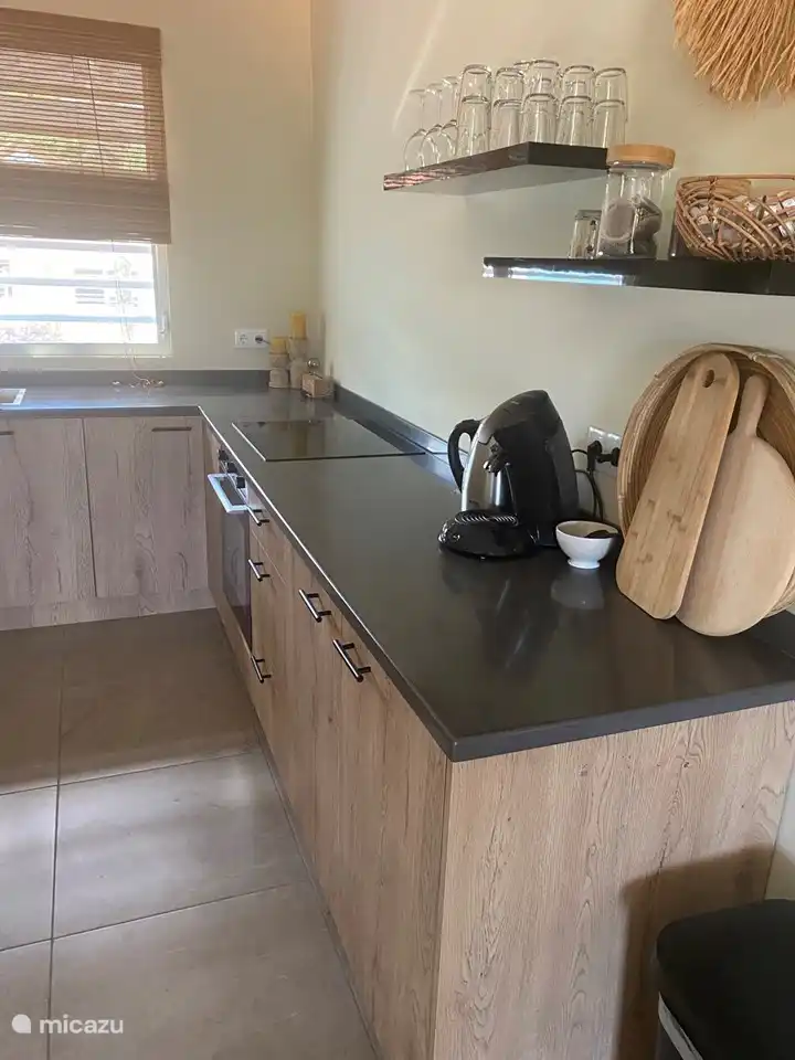 Corner kitchen with all necessary equipment.