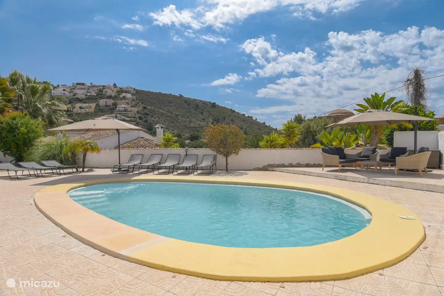 Deep and spacious swimming pool with a comfortable wide staircase.