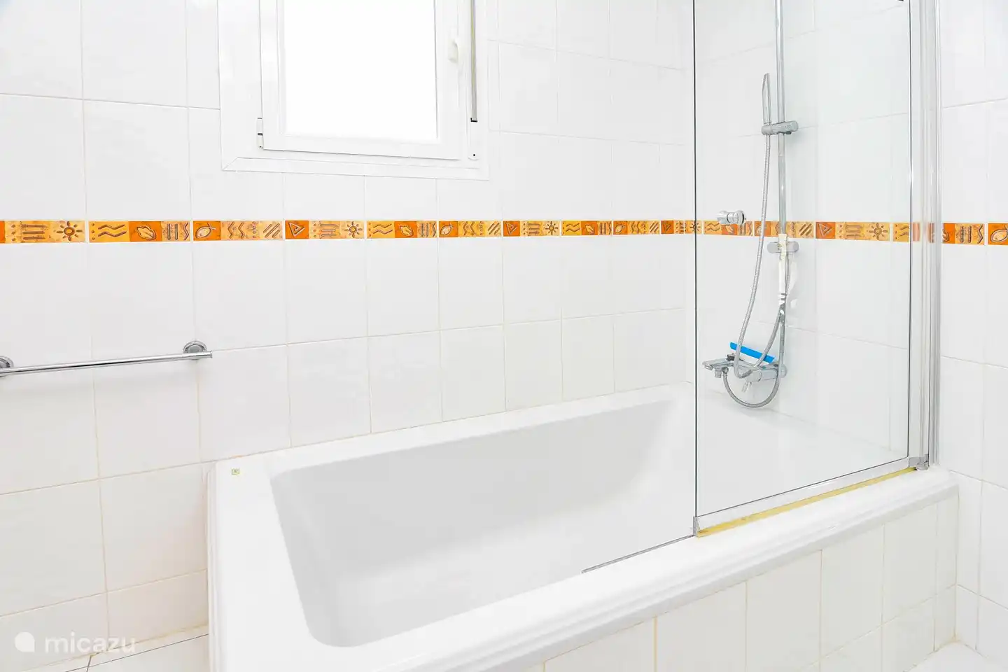 Spacious bathroom with sink, shower, bath and toilet.