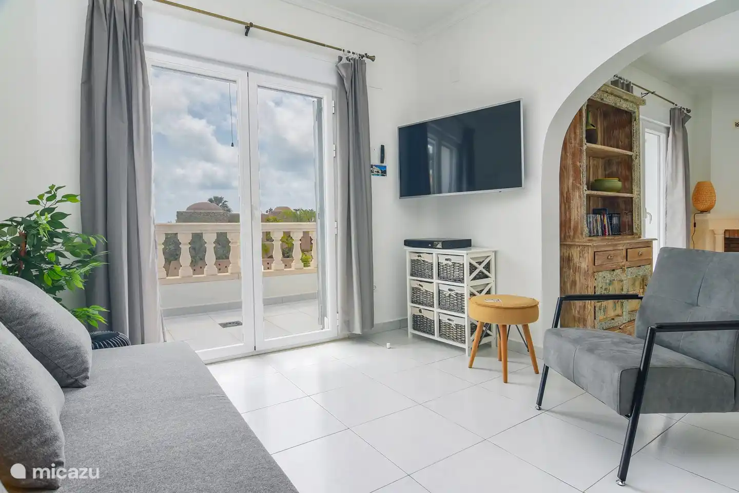 Second living room on the first floor with patio doors to the balcony.