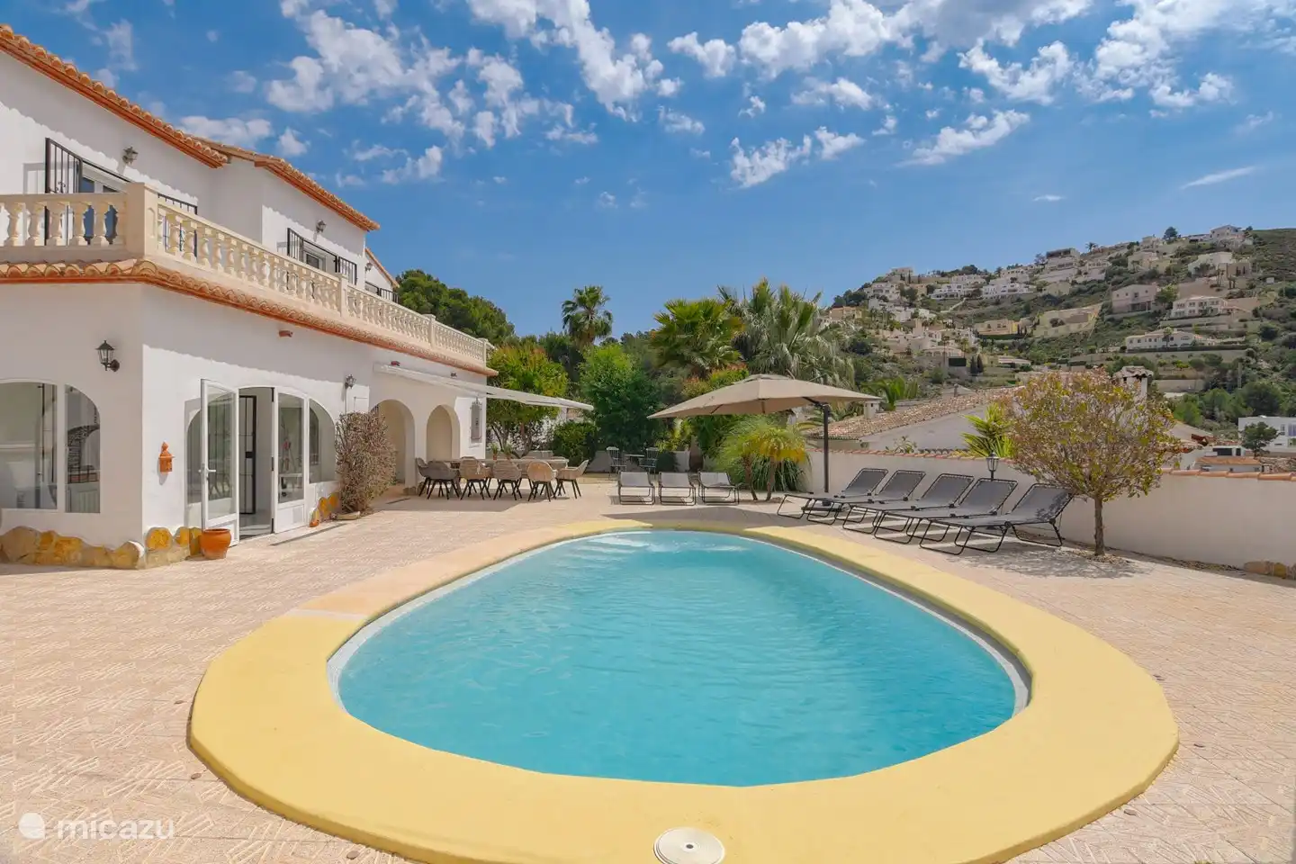 Deep and spacious swimming pool with a comfortable wide staircase.