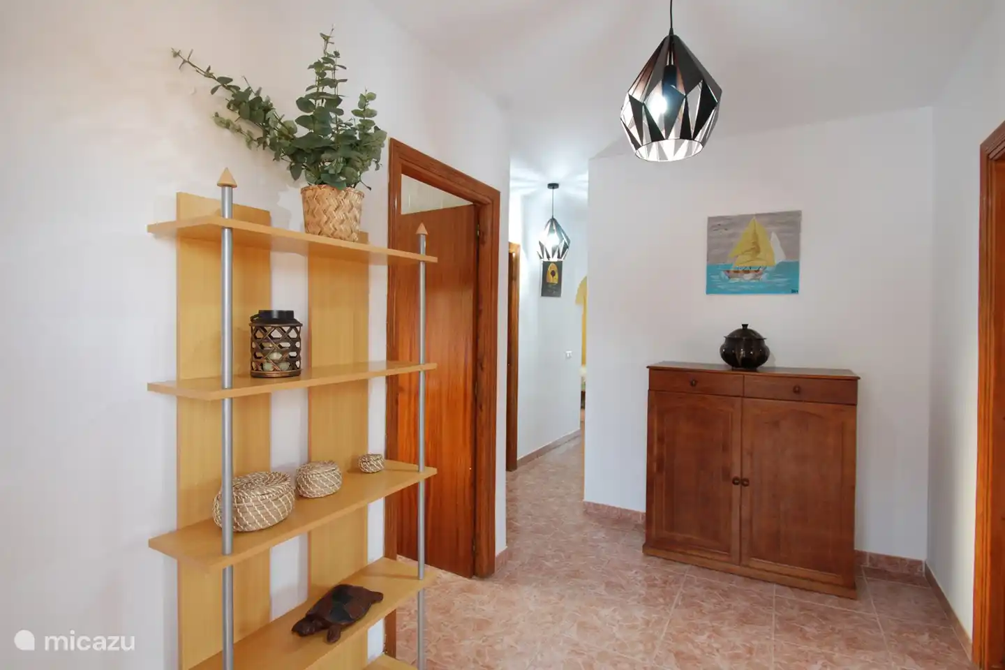 The entrance hall with direct access to the kitchen and living room.
