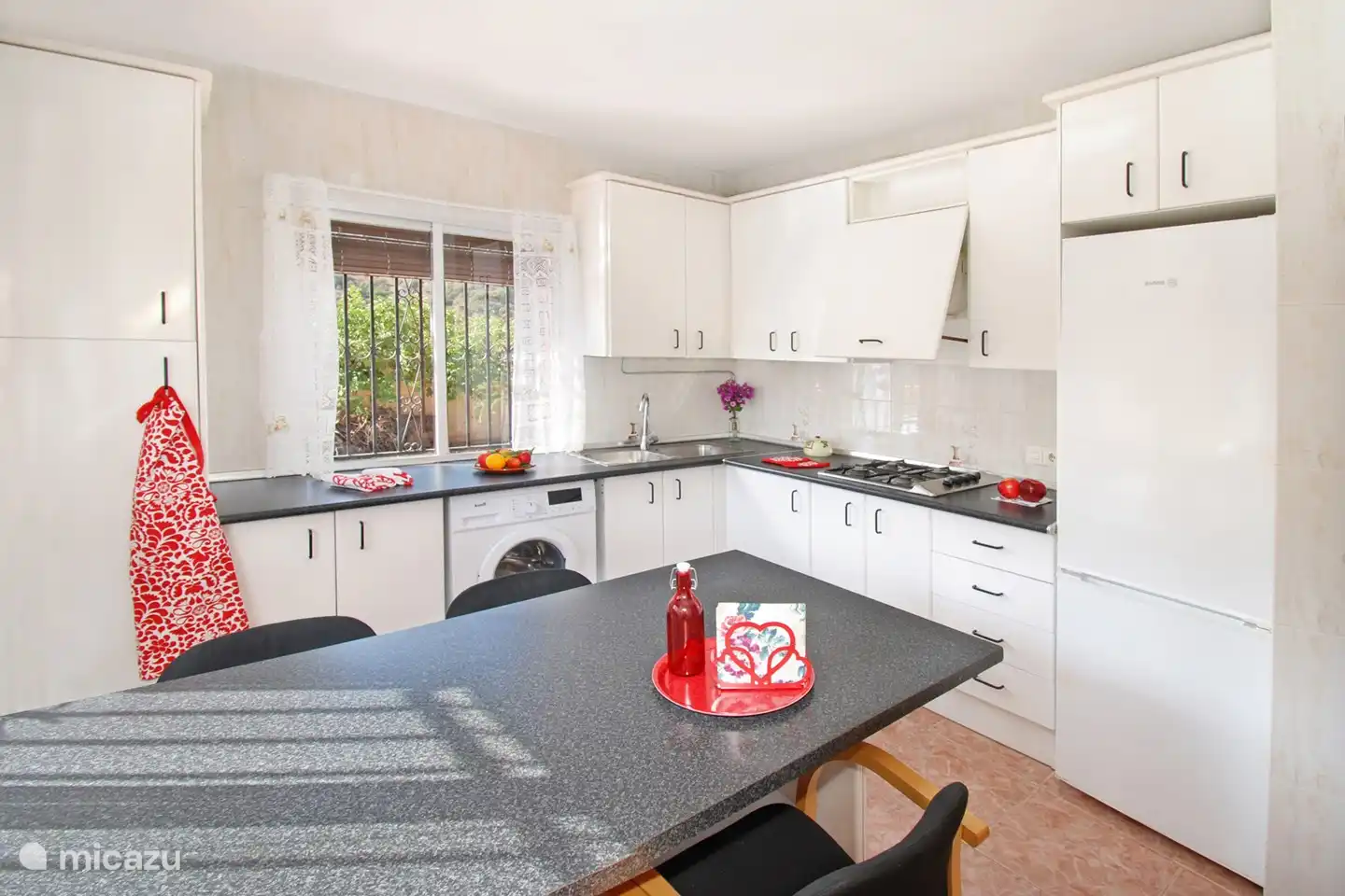 There are a table and chairs in the kitchen so you can also eat here.