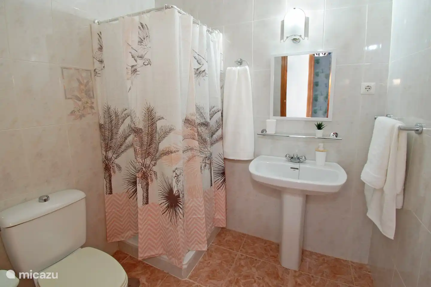 Bathroom 2 with shower, sink and toilet.