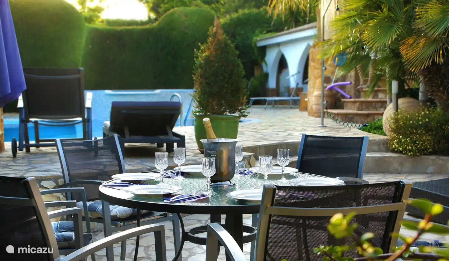 Outdoor dining area by the pool