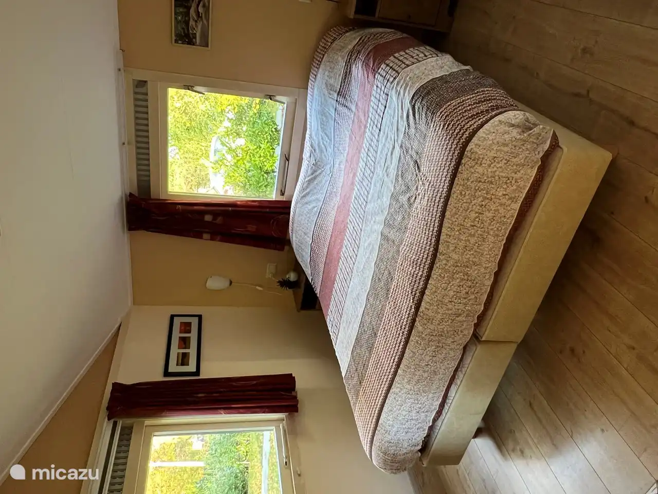 Bedroom 2 1 x 2 person box spring with storage cupboard for clothes.