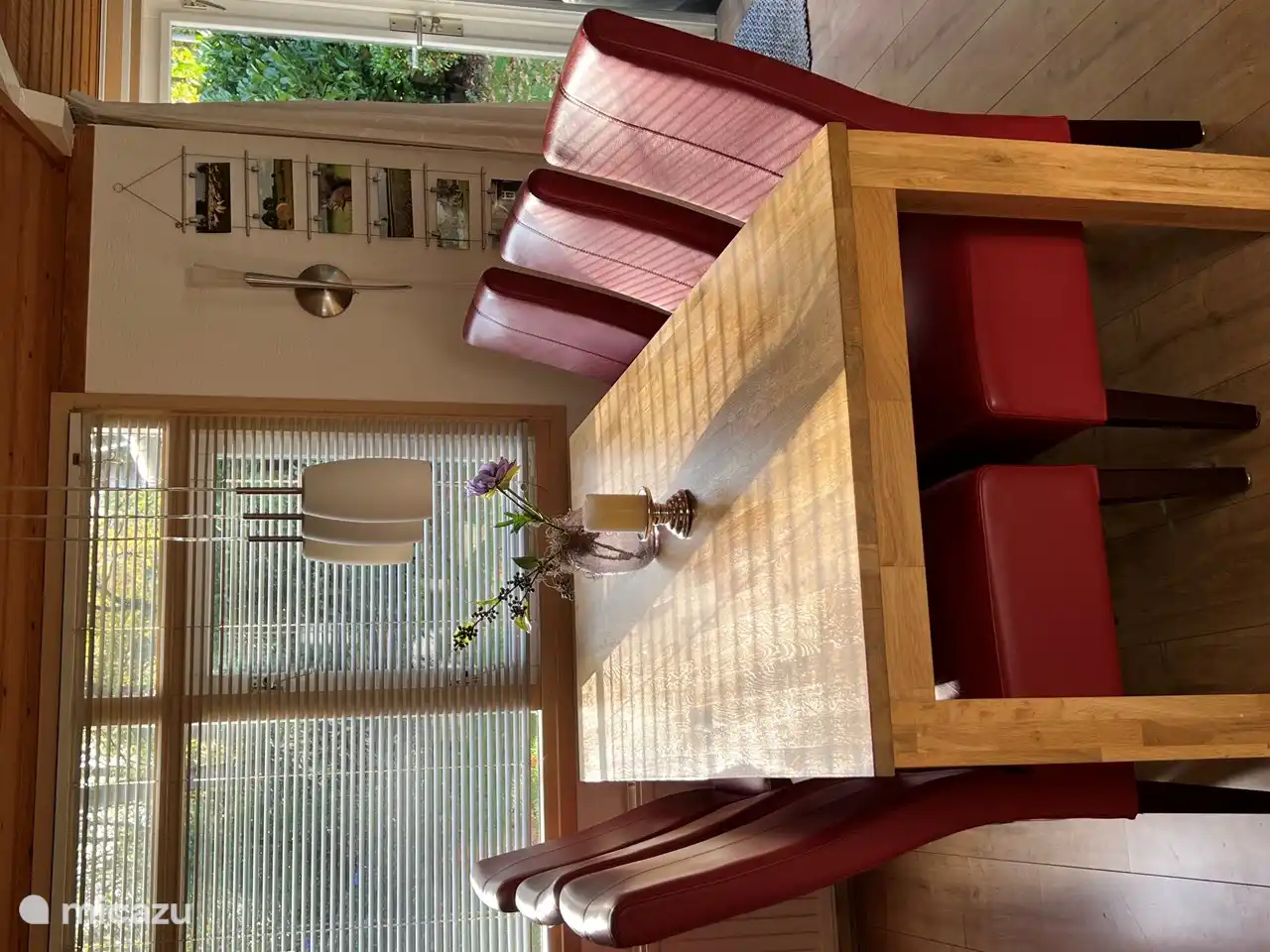 Spacious dining area with large table and 6 chairs.