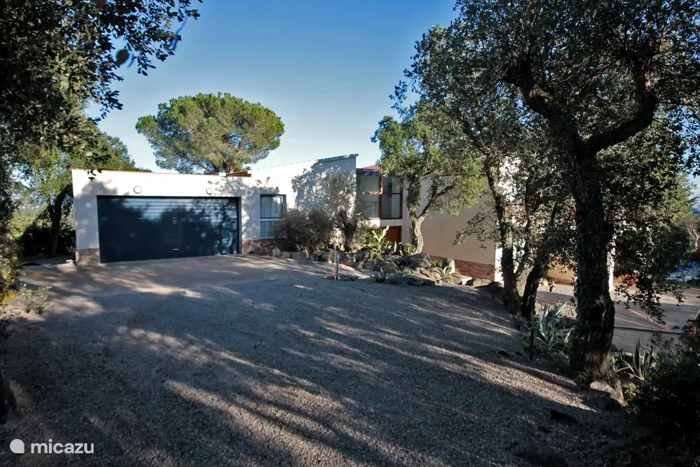 parking on the grounds of the villa