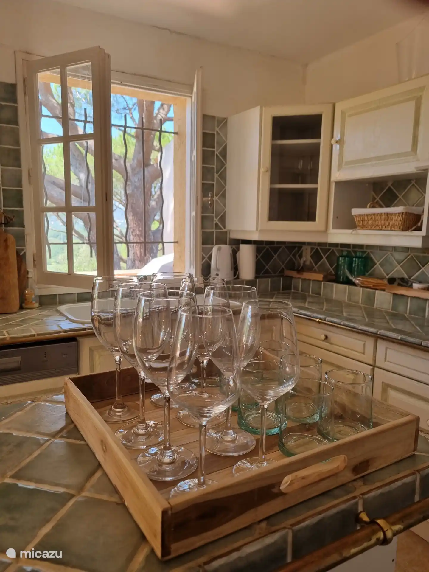 Kitchen with dishwasher, oven, microwave, Nespresso coffee, kettle, milk frother, refrigerator with freezer. 