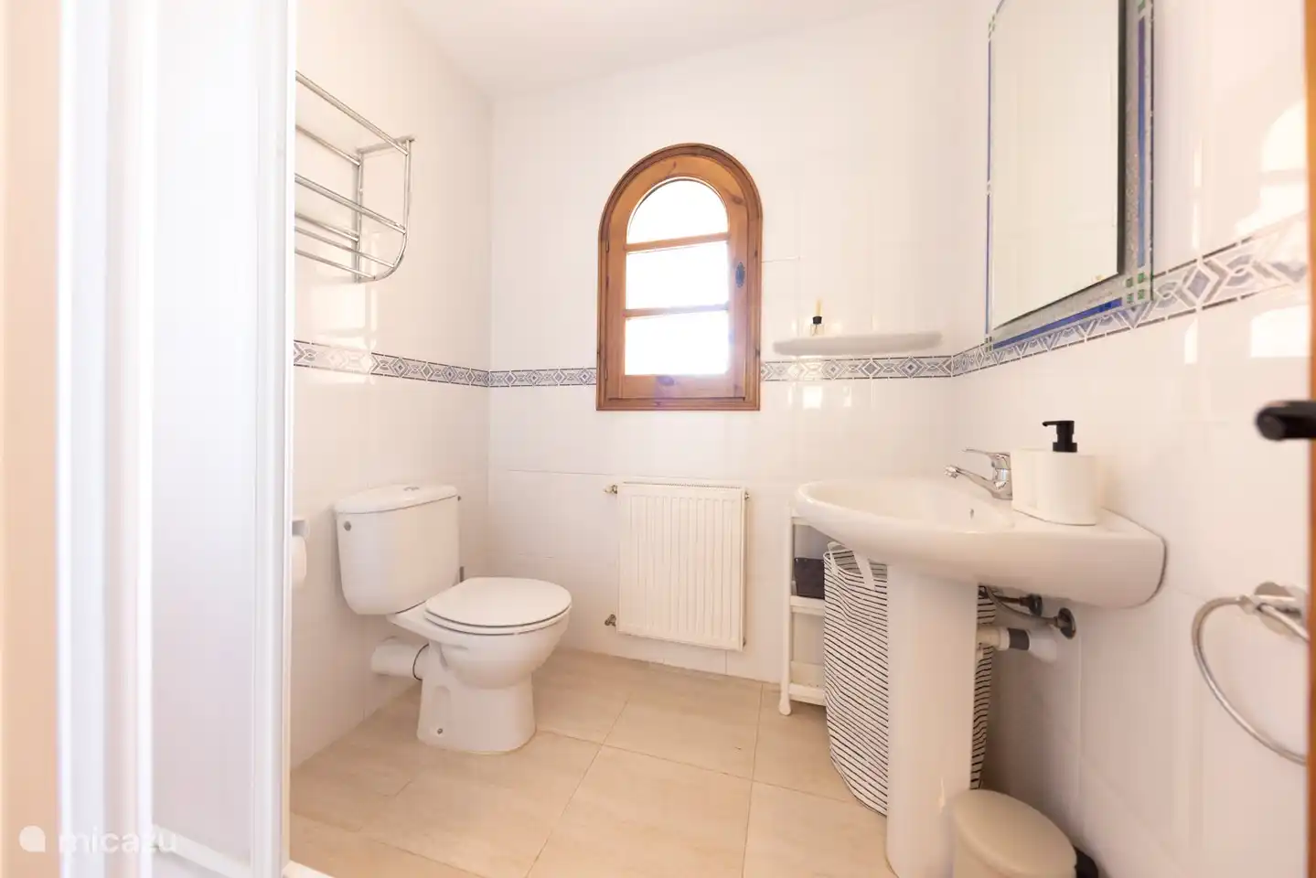 Bathroom with shower, sink and toilet