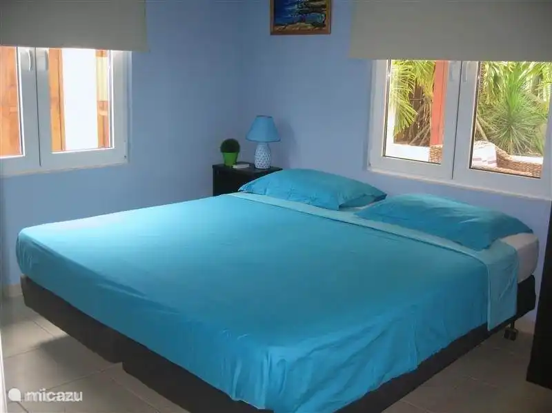 2nd bedroom with box spring air conditioning and also large closet with hanging and shelves