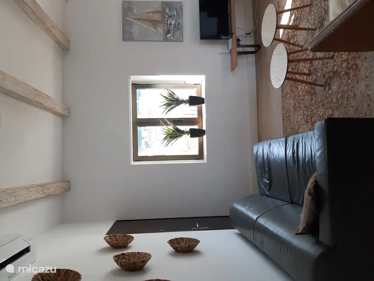 Living room with 2 nice leather sofas to relax in front of the TV