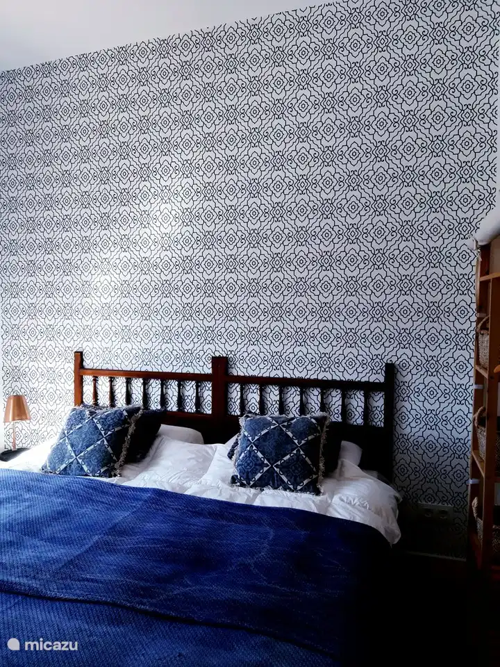 Bedroom with double bed {box spring beds 2x 90x200} with a view of the square and the castle of Denia. equipped with fan and air conditioning hot and cold