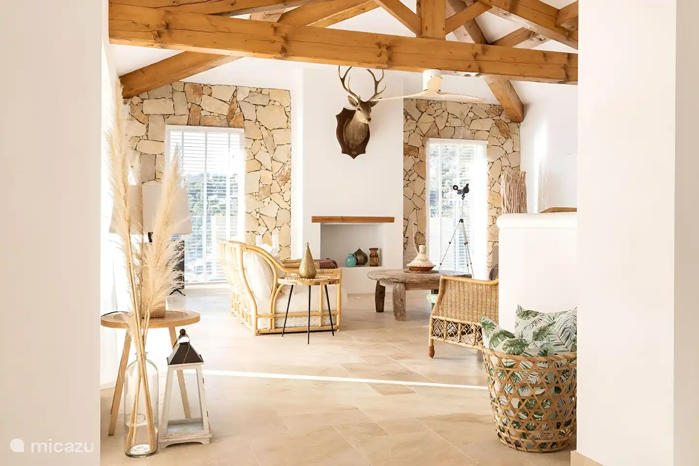 Living room with fireplace overlooking the swimming pool and the bay of Saint Tropez