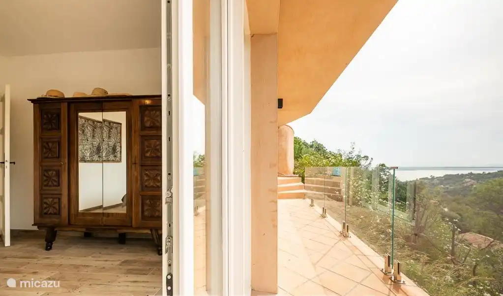 Large balcony adjacent to bedrooms with sea views