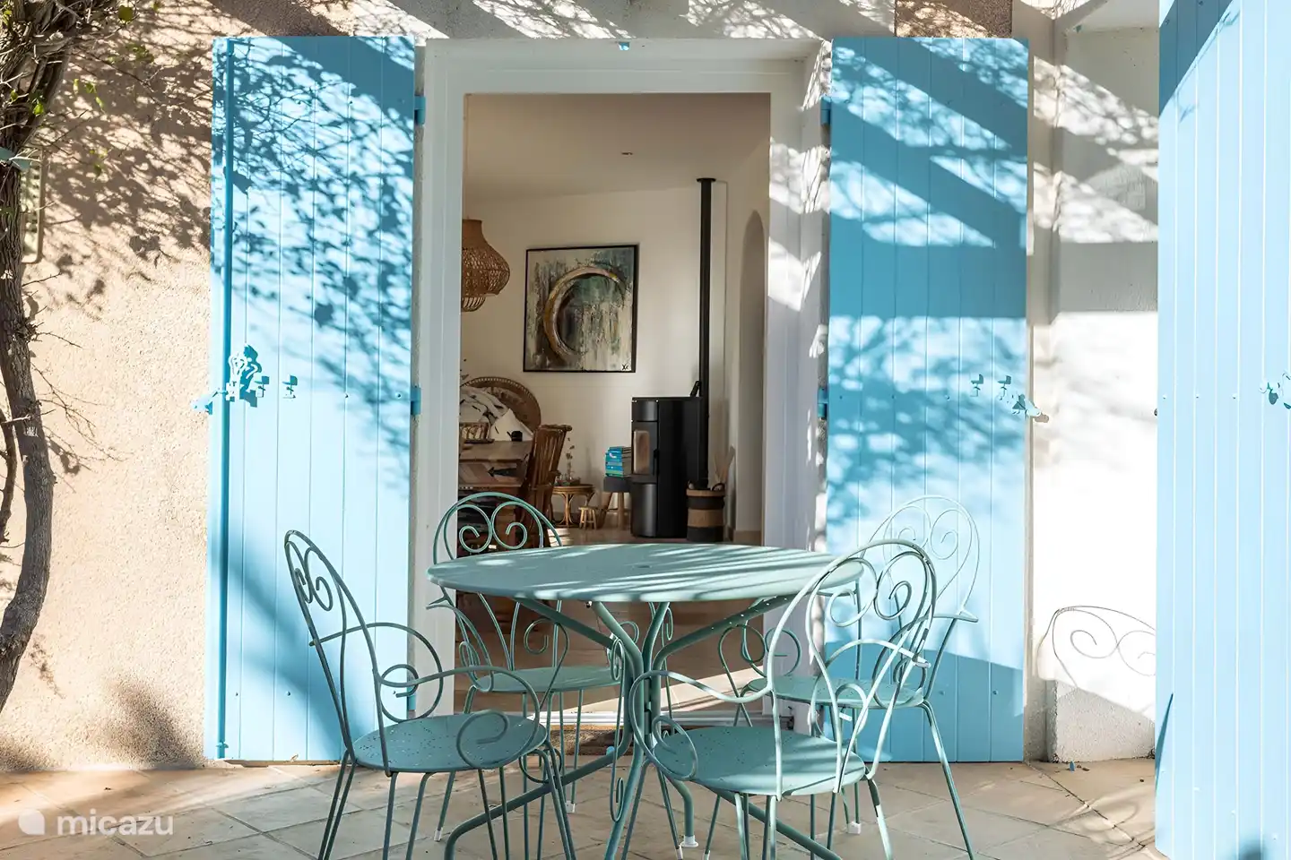 View from outdoor kitchen to villa. Also a view of the swimming pool.