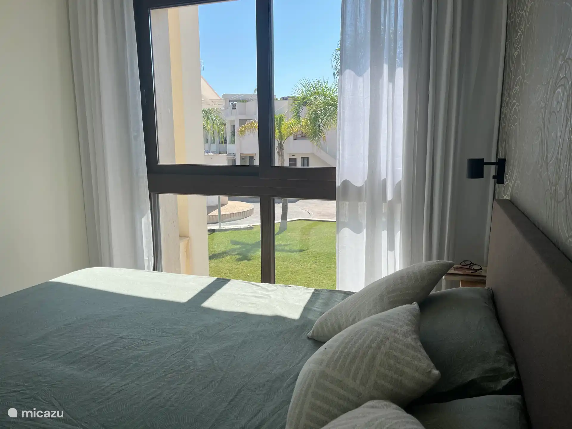 Master bedroom with ensuite bathroom overlooking the pool 