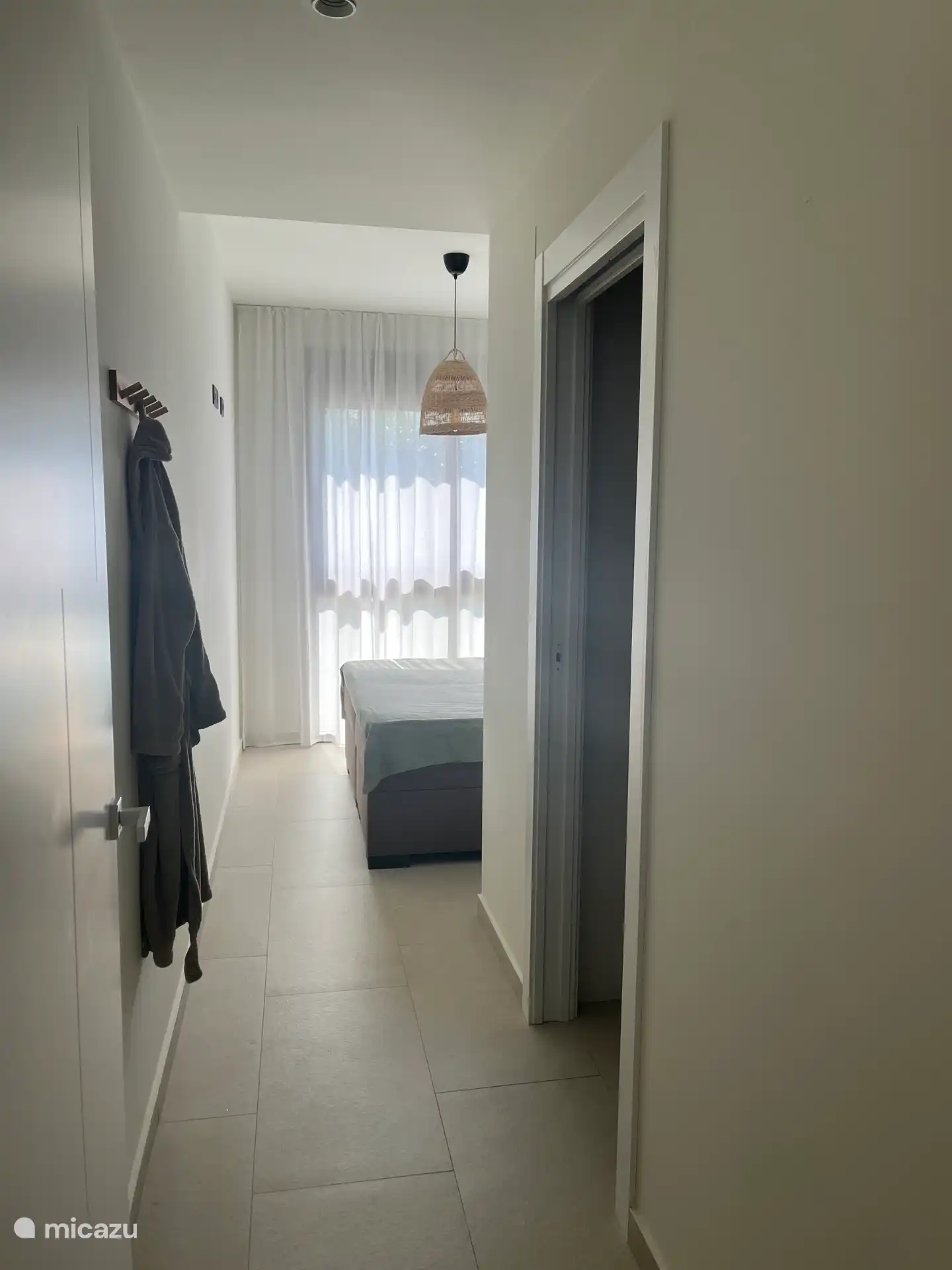Master bedroom with ensuite bathroom overlooking the pool 