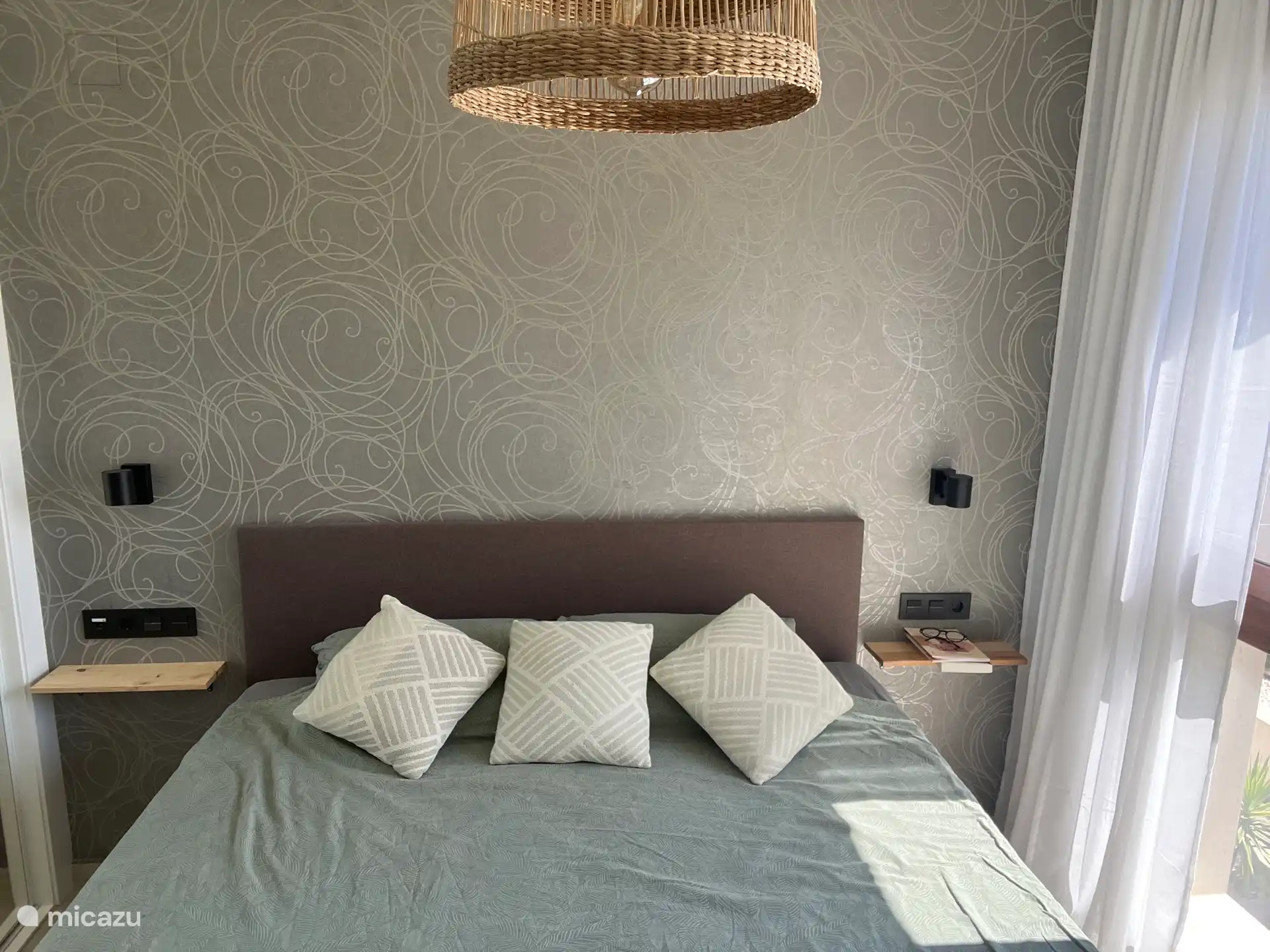 Master bedroom with ensuite bathroom overlooking the pool 