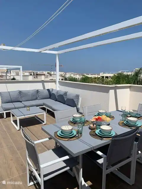 Sun terrace with a view of the pool and the salt lake