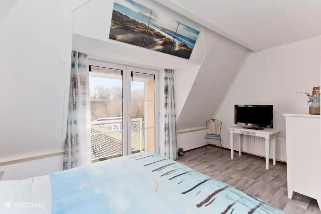Slaapkamer met balkon Vakantiehuis in Kamperland (Zeeland, Nederland)